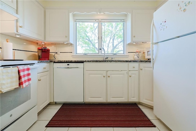 kitchen featuring white cabinetry, light tile patterned flooring, white appliances, and decorative backsplash