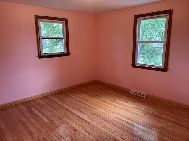 10 Lawnwood Rd, Coventry, RI 02816 - empty room featuring healthy amount of natural light and light wood-type flooring