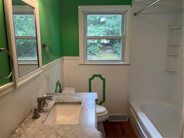 10 Lawnwood Rd, Coventry, RI 02816 - full bathroom with vanity, tub / shower combination, wood finished floors, and a wainscoted wall