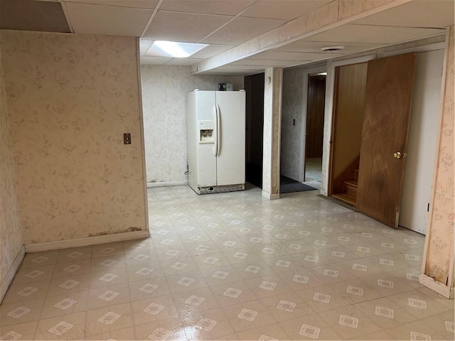 10 Lawnwood Rd, Coventry, RI 02816 - finished below grade area with white refrigerator with ice dispenser, wallpapered walls, light floors, and a drop ceiling