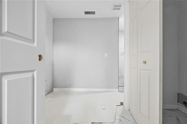 bathroom with marble finish floor and visible vents