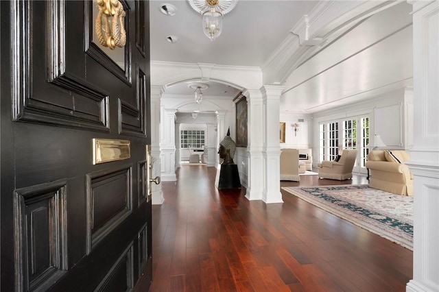 540 Blackstone Blvd, Providence, RI 02906 - foyer entrance featuring ornamental molding, ornate columns, a decorative wall, arched walkways, and dark wood-style floors