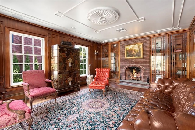 540 Blackstone Blvd, Providence, RI 02906 - living area featuring visible vents, wood finished floors, and a brick fireplace
