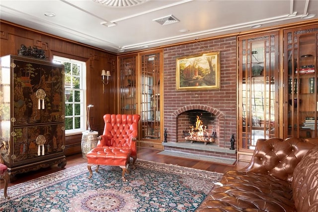 540 Blackstone Blvd, Providence, RI 02906 - living area featuring a fireplace, ornamental molding, visible vents, and wood finished floors