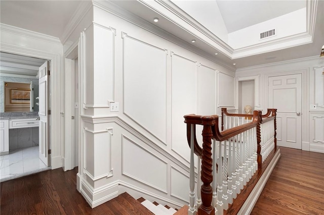 540 Blackstone Blvd, Providence, RI 02906 - hallway with an upstairs landing, crown molding, dark wood finished floors, visible vents, and a decorative wall