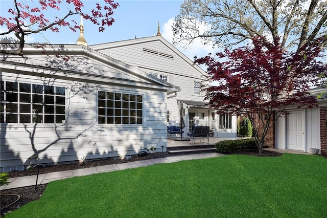 540 Blackstone Blvd, Providence, RI 02906 - back of property featuring a patio and a lawn