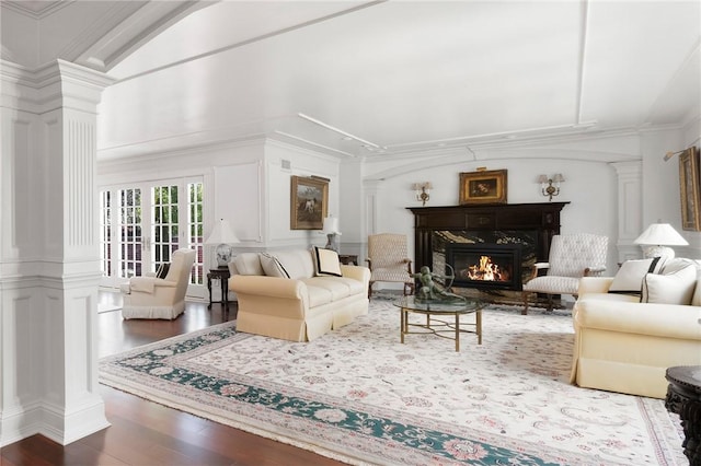 540 Blackstone Blvd, Providence, RI 02906 - living room featuring a decorative wall, wood finished floors, a fireplace, and ornate columns