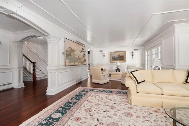 540 Blackstone Blvd, Providence, RI 02906 - living room with stairs, a decorative wall, decorative columns, dark wood-type flooring, and visible vents