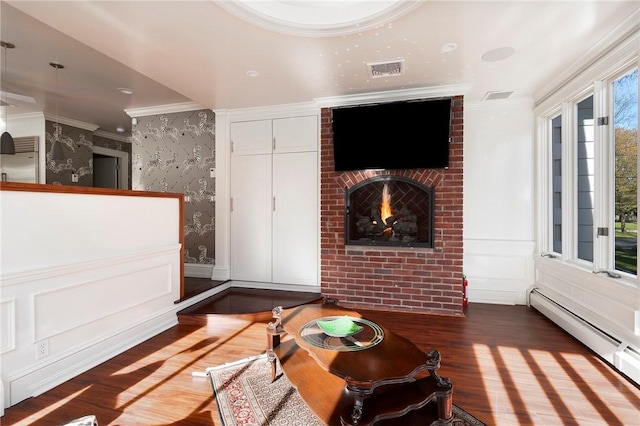 540 Blackstone Blvd, Providence, RI 02906 - living room featuring wallpapered walls, a baseboard heating unit, visible vents, crown molding, and wood finished floors