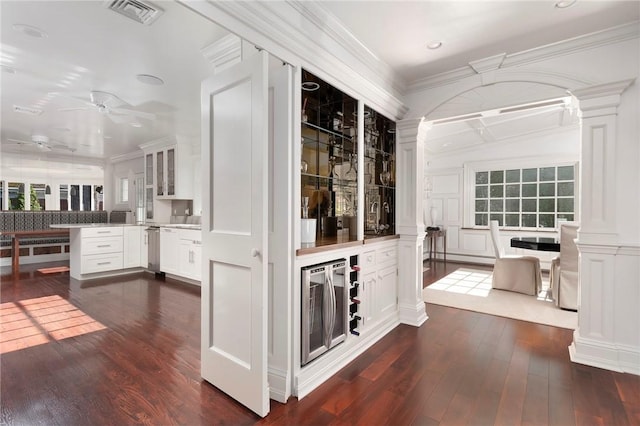 540 Blackstone Blvd, Providence, RI 02906 - interior space with a ceiling fan, decorative columns, dark wood finished floors, visible vents, and wine cooler