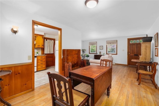 dining area featuring light wood-style flooring