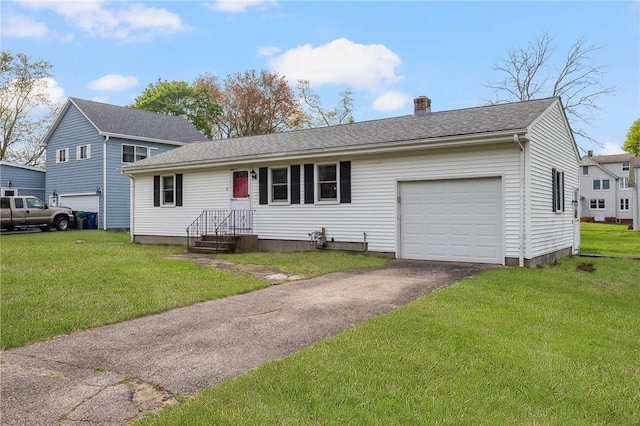 split level home featuring aphalt driveway, a garage, a chimney, and a front yard