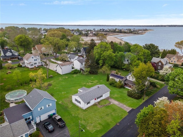 bird's eye view featuring a water view and a residential view