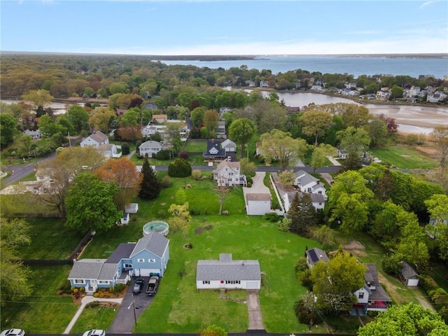 birds eye view of property with a water view and a residential view