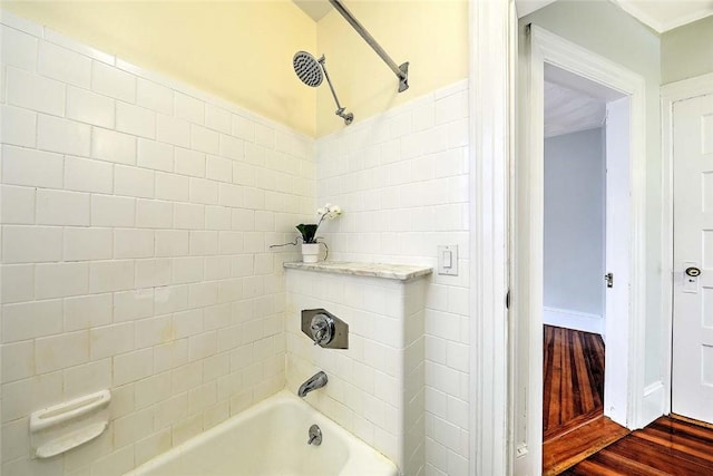 bathroom with  shower combination and wood finished floors