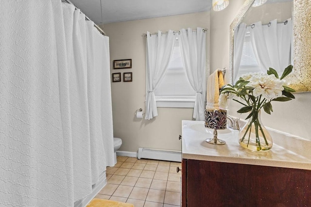 full bathroom with toilet, vanity, a baseboard radiator, tile patterned flooring, and baseboards