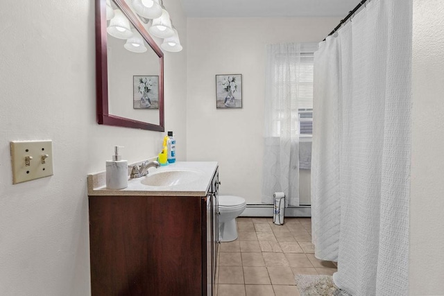 bathroom featuring vanity, toilet, and tile patterned flooring