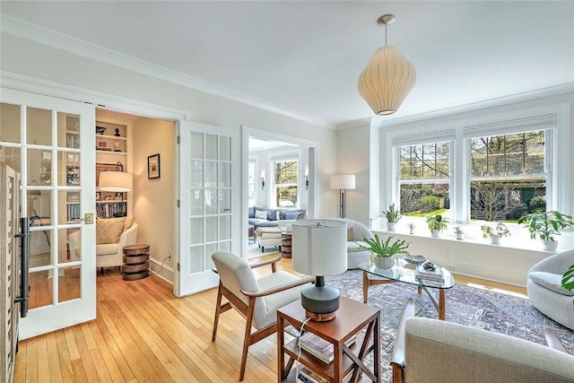 sunroom / solarium featuring french doors