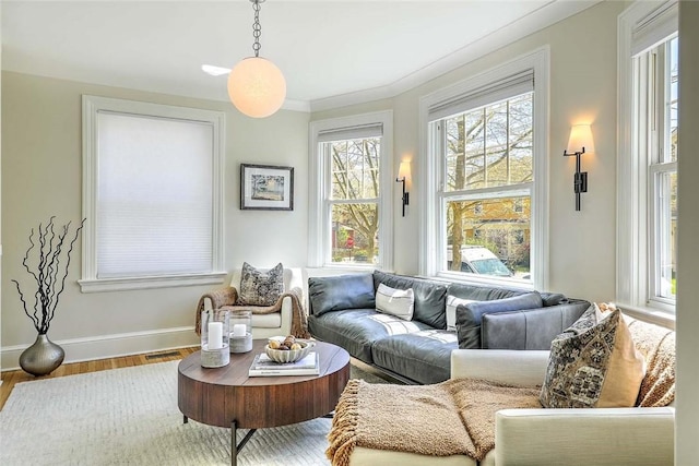 interior space featuring baseboards and wood finished floors