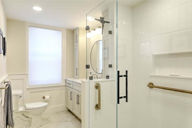 full bathroom featuring vanity, toilet, a shower stall, and recessed lighting