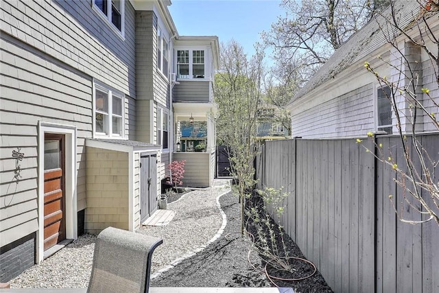view of home's exterior featuring fence