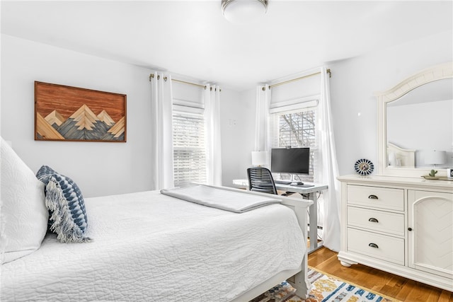 bedroom with light wood-style floors