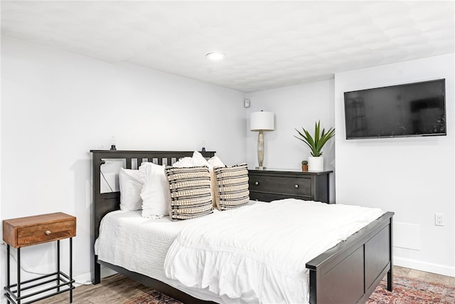 bedroom featuring recessed lighting, baseboards, and wood finished floors