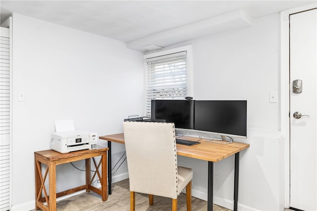 office with baseboards and wood finished floors