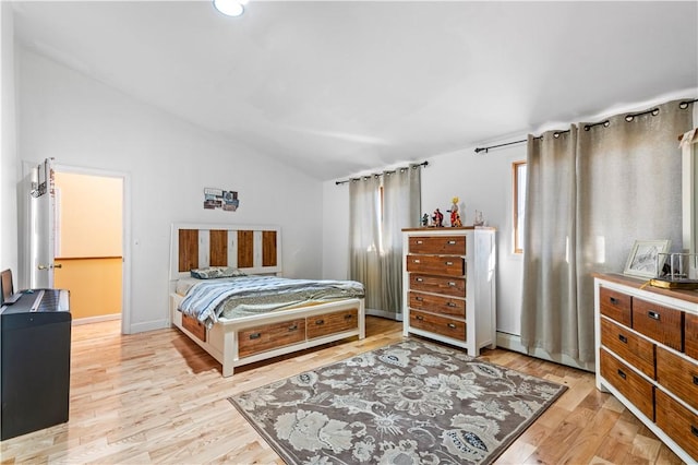 215 Rocky Point Ave, Warwick, RI 02889 - bedroom with light wood finished floors, lofted ceiling, and a baseboard radiator