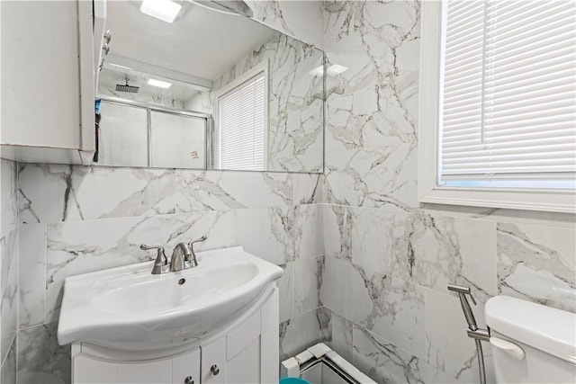 215 Rocky Point Ave, Warwick, RI 02889 - bathroom with tile walls, toilet, visible vents, vanity, and a shower