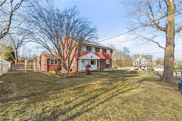 215 Rocky Point Ave, Warwick, RI 02889 - back of property featuring a yard, a chimney, and fence