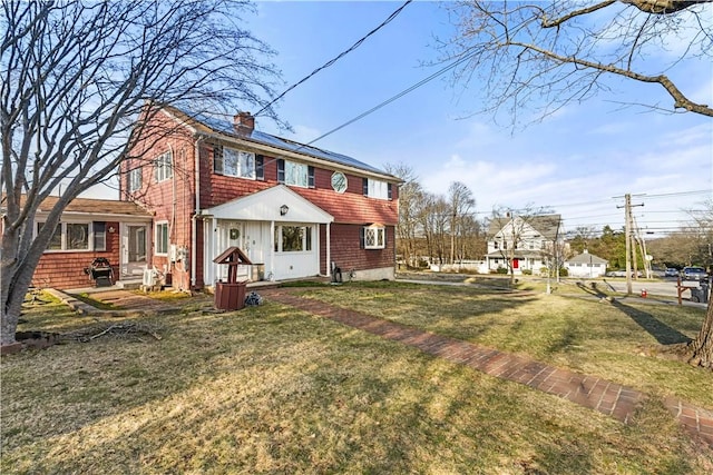 215 Rocky Point Ave, Warwick, RI 02889 - back of house featuring a chimney and a lawn