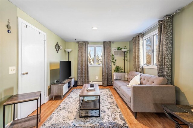 215 Rocky Point Ave, Warwick, RI 02889 - living room with baseboards, recessed lighting, a baseboard radiator, and light wood-type flooring