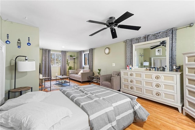 215 Rocky Point Ave, Warwick, RI 02889 - bedroom with light wood-style flooring and ceiling fan
