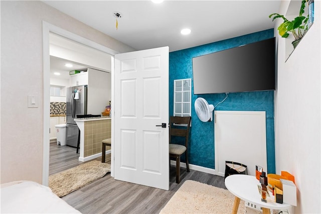 193 Harrison St, Pawtucket, RI 02860 - bedroom with freestanding refrigerator, baseboards, light wood-type flooring, and recessed lighting