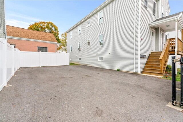 193 Harrison St, Pawtucket, RI 02860 - view of side of property featuring stairway and fence