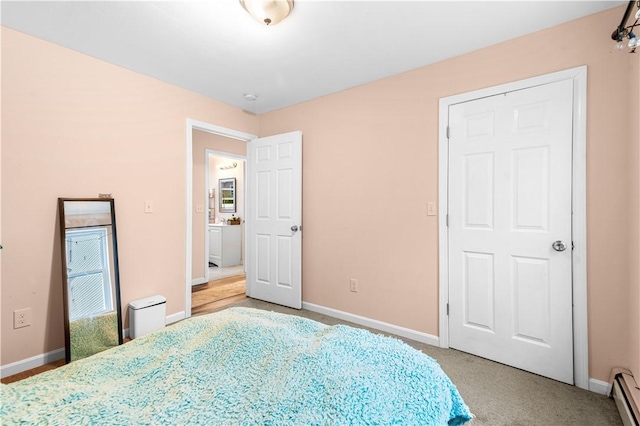 193 Harrison St, Pawtucket, RI 02860 - bedroom with light carpet, baseboards, and baseboard heating