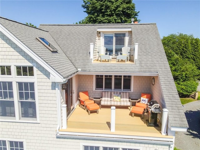 back of property with a deck