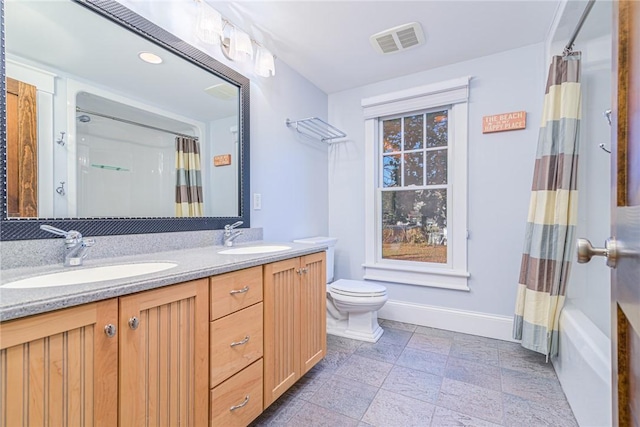 full bathroom with baseboards, toilet, visible vents, and a sink