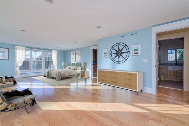 living room featuring wood finished floors and baseboards