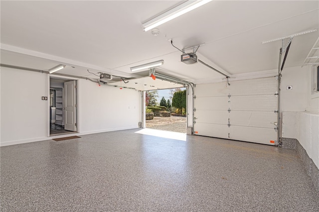 garage featuring baseboards and a garage door opener
