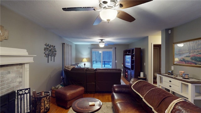 4 Tray Hollow Rd, Foster, RI 02825 - living area with a brick fireplace, ceiling fan, and wood finished floors