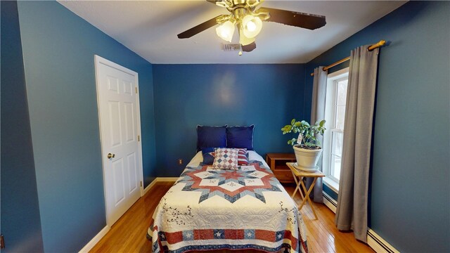 4 Tray Hollow Rd, Foster, RI 02825 - bedroom with light wood finished floors, baseboard heating, and ceiling fan