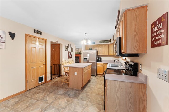 51 Mill Rd, Foster, RI 02825 - kitchen featuring appliances with stainless steel finishes, a breakfast bar, light countertops, a kitchen island, and a chandelier