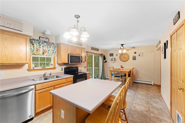 51 Mill Rd, Foster, RI 02825 - kitchen with appliances with stainless steel finishes, a sink, a baseboard heating unit, a breakfast bar, and a center island