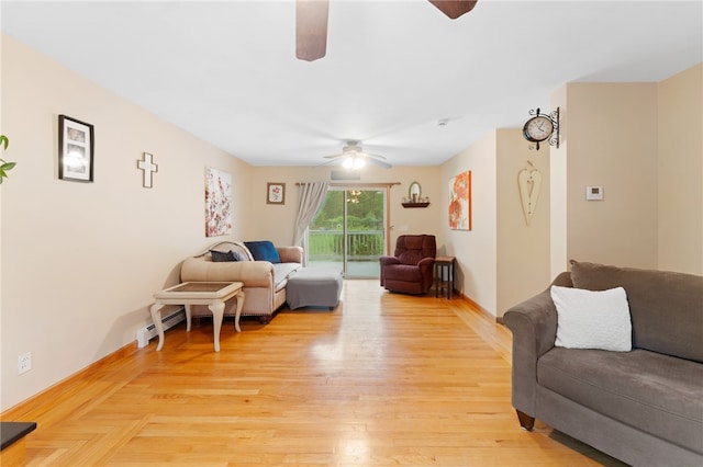 51 Mill Rd, Foster, RI 02825 - living area featuring ceiling fan, baseboard heating, light wood-type flooring, and baseboards