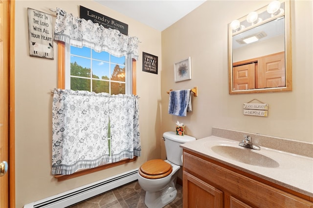 51 Mill Rd, Foster, RI 02825 - bathroom featuring baseboard heating, vanity, and toilet
