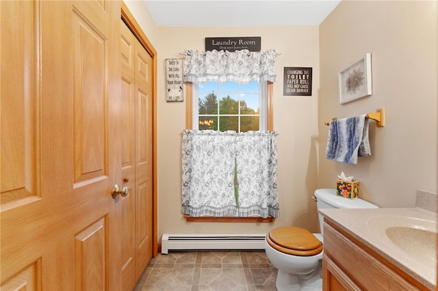 51 Mill Rd, Foster, RI 02825 - bathroom featuring baseboard heating, toilet, and vanity