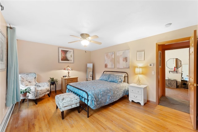 51 Mill Rd, Foster, RI 02825 - bedroom featuring a baseboard heating unit, light wood-style flooring, a ceiling fan, and baseboards