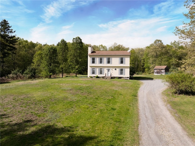 51 Mill Rd, Foster, RI 02825 - view of front of home featuring dirt driveway, a chimney, a front lawn, and a wooded view